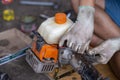 A small lawnmower Was disassembled for repair By a Thai mechanic The mower was adapted from a motorbike Royalty Free Stock Photo