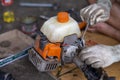 A small lawnmower Was disassembled for repair By a Thai mechanic The mower was adapted from a motorbike Royalty Free Stock Photo