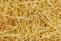 Small layer of dry noodles. The food background is a pasta texture. Homemade noodles. Cooking. Background. Texture. View from