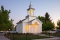 small lds meetinghouse against a clear evening sky