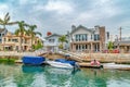 Small leaisure boats on canal in the picture perfect neighborhood of Long Beach Royalty Free Stock Photo