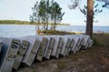 Small learning school boat overturned Rowboats On Dock sand lake beach Royalty Free Stock Photo