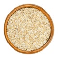 Oatmeal, rolled white oats in wooden bowl Royalty Free Stock Photo