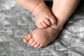 Baby feet close up on bedspread Royalty Free Stock Photo