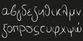 Small letters of the Greek alphabet in white chalk on a blackboard Royalty Free Stock Photo