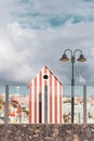 Small lifeguard`s booth painted on white and red vertical stripes Royalty Free Stock Photo