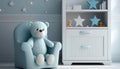 Small light blue armchair for kid standing in white room interior with stars on the wall, white rug and cupboard with books, teddy