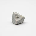 The rock is placed on a plain white background, emphasizing its form and texture Royalty Free Stock Photo
