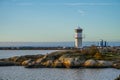 Small light house near a port.. Royalty Free Stock Photo
