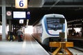 Small light rail commuter train type SLT along station platform