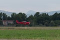 Small and Light Red Piper Aircraft Taking off from the Runway Royalty Free Stock Photo