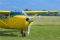 Small and Light Yellow Piper Aircraft near to the Runaway Ready to Take Off Royalty Free Stock Photo