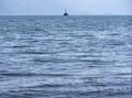 Small lighthouse in the Aegean sea near the Greek island of Evia, Greece Royalty Free Stock Photo