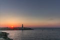The small lighthouse at the entrance of the harbour in Tel Aviv at sunset Royalty Free Stock Photo