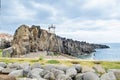 The small lighthouse Farol de Camara de Lobos, built on top of a promontory. Madeira, Europe