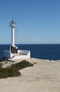 Small Lighthouse on Mallorca torre porto petro, water activities Royalty Free Stock Photo