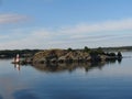 Small lighthouse on small island.