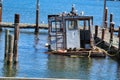 A small listing rusting boat taking Royalty Free Stock Photo