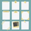 Small little attached blank paper notes on teal background Royalty Free Stock Photo