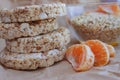 Small load of puffed rice bread with tangerine Royalty Free Stock Photo