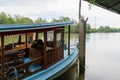 Small local ferry boat docking along the river,
