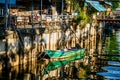 A small local fishing boat is moored in the canal at Ban Na Kluea, Pattaya, Thailand