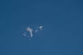 Small lone cirrus cloud in deep blue sky Royalty Free Stock Photo