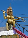 A small Lord Shiva statue at the roof of one of many Hindu temples in Mauritius Royalty Free Stock Photo