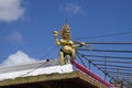A small Lord Shiva statue at the roof of one of many Hindu temples in Mauritius Royalty Free Stock Photo