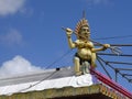 A small Lord Shiva statue at the roof of one of many Hindu temples in Mauritius Royalty Free Stock Photo