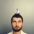 Small man resting on the big head man Royalty Free Stock Photo