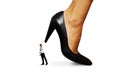 Small man under big heel Royalty Free Stock Photo