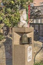 Small marble statue depicting the head of the buddhist goddess of compassion Kannon Bosatsu with at its base the word JÃÂshin