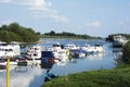 Small marine on river with colorful boats