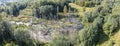 Small marsh among green forest. aerial panoramic view Royalty Free Stock Photo