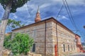 Small masjid or mosque and its minaret extend to blue and magnificent sky i