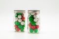 2 small mason jars filled with Christmas candy