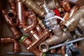 Small material for plumbers and heating installers. Copper, brass, steel, pipes, angles.