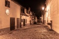 Small medieval houses in Golden Lane by night, Prague Castle, Czech Republic