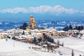 Small medieval town on snowy hill in Northern Italy.