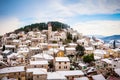 Small Mediterranean town on slopes of hill with church on top Royalty Free Stock Photo