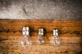 Small, medium and large bulbs on the nails on the old wooden Royalty Free Stock Photo