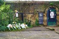 Small memorial with bouquets for the queen's death in a park in Guisborough, UK Royalty Free Stock Photo