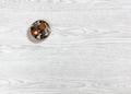 Small Metal Box Full of Buttons On a Wooden Background Royalty Free Stock Photo