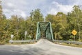 Small metal bridge spanning rock river in Williamsville, Vermont