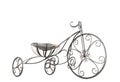 Small metal decorative tricycle close-up.