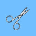 Small metal sewing scissors on blue background.
