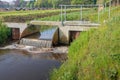 Small metal weir in a Dutch polder ditch Royalty Free Stock Photo