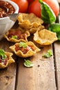 Small mexican style appetizers made with tortilla bowls