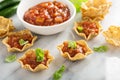 Small mexican style appetizers made with tortilla bowls